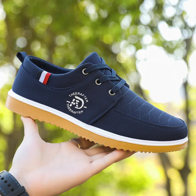 Men's black canvas casual shoes with a leather toe cap and platform sole.