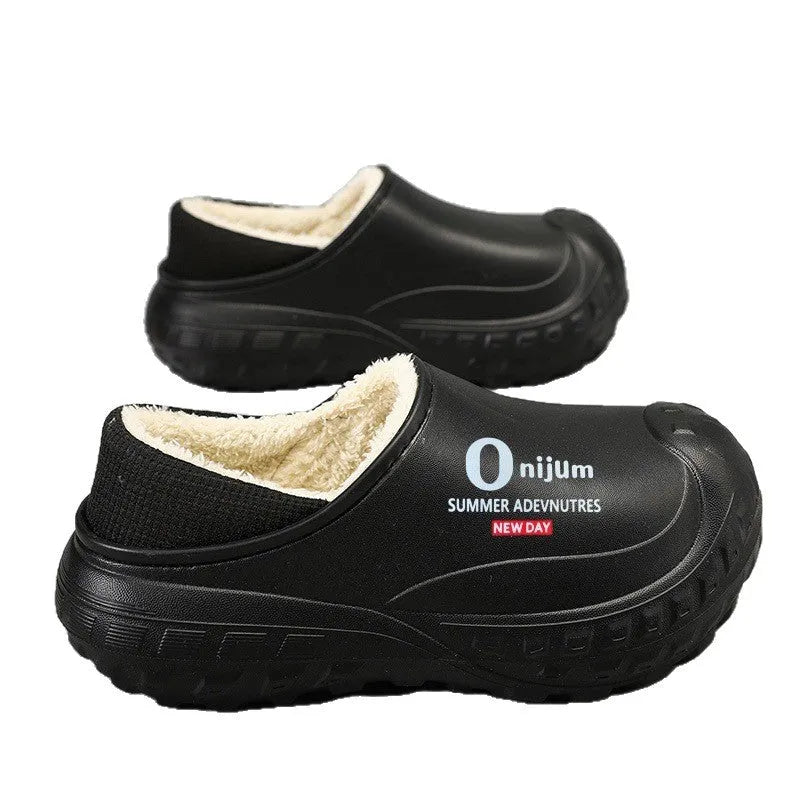 Winter fleece-lined men's home cotton shoes with anti-slip sole, printed letter pattern in black, on a floor