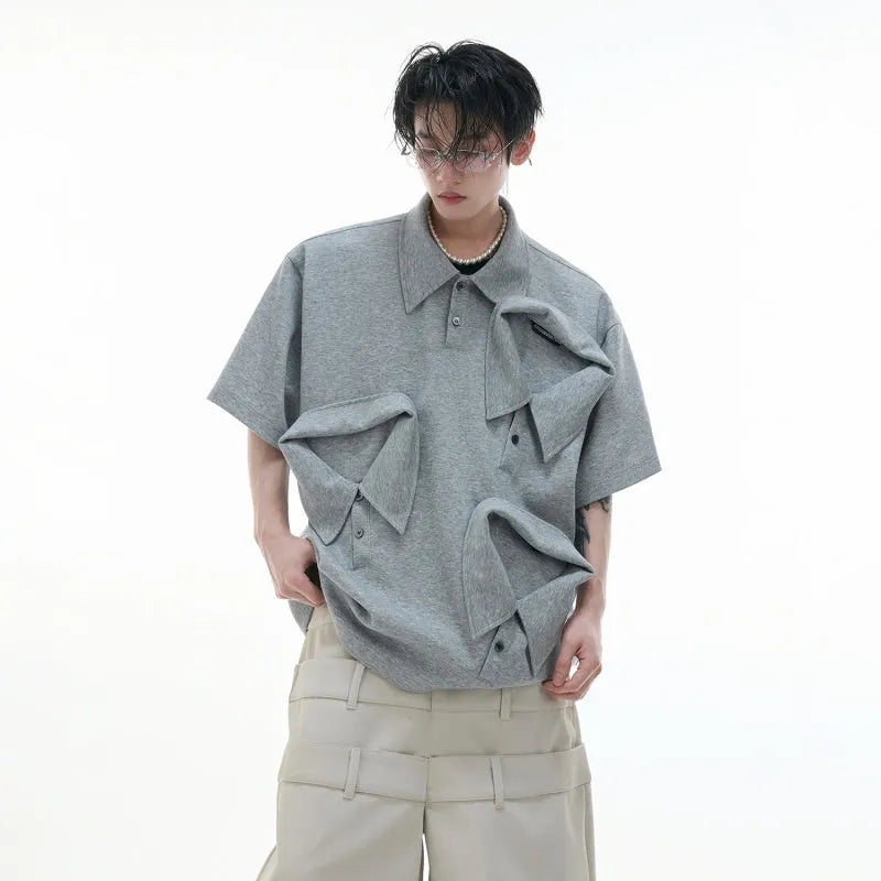 Men's loose deconstructed collar polo shirt with geometric pattern in black.