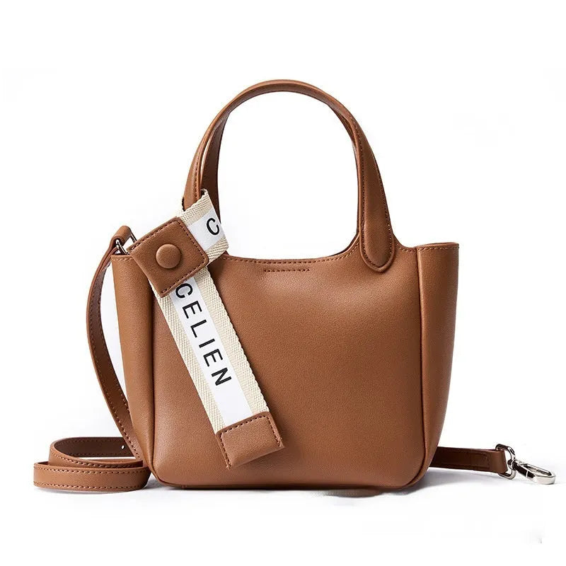 Genuine cattlehide leather cross body bucket bag in square vertical retro style.