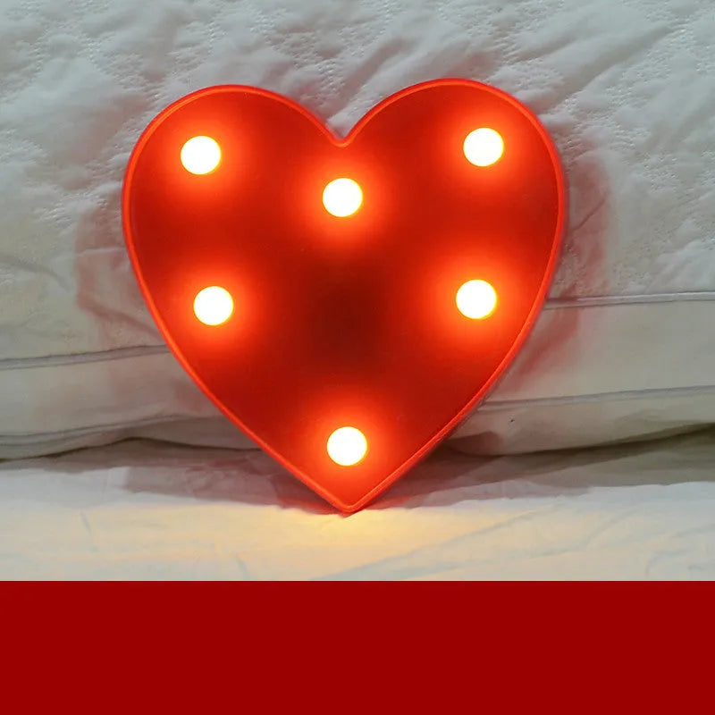 Plastic LED letter light decoration spelling a message, 22cm in height.