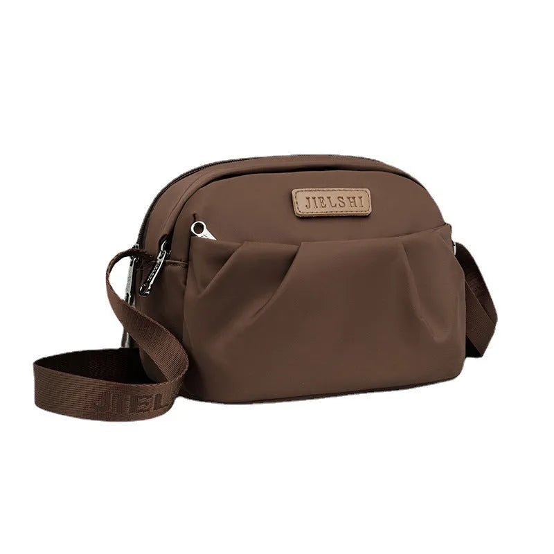 Pleated Oxford cloth shoulder messenger bag in horizontal square shape with crossbody strap