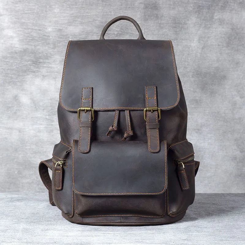 Brown genuine cowhide leather backpack with double shoulder straps and soft handle