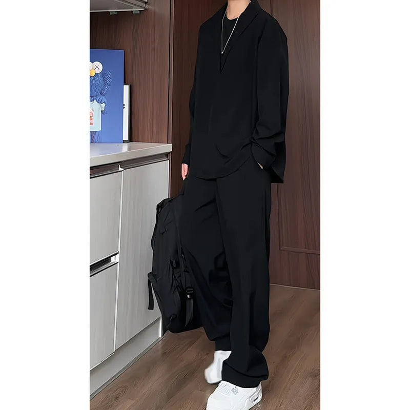 Men's black casual two-piece suit with long sleeve polo shirt and matching trousers in slim fit design