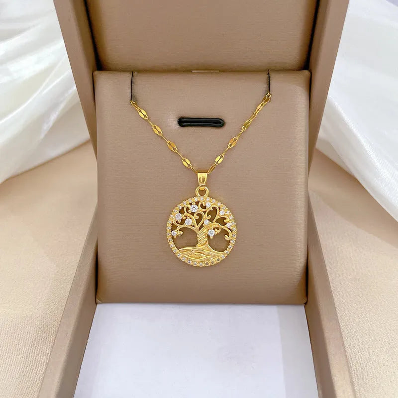 Gold-plated cross pendant necklace with micro-inlaid mother of pearl and rhinestone design on an adjustable chain.
