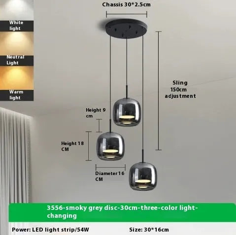 Italian minimalist glass chandelier with tricolor light in a dining room setting