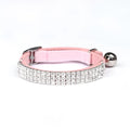 Adjustable red velvet cat collar with rhinestone decoration on a white background