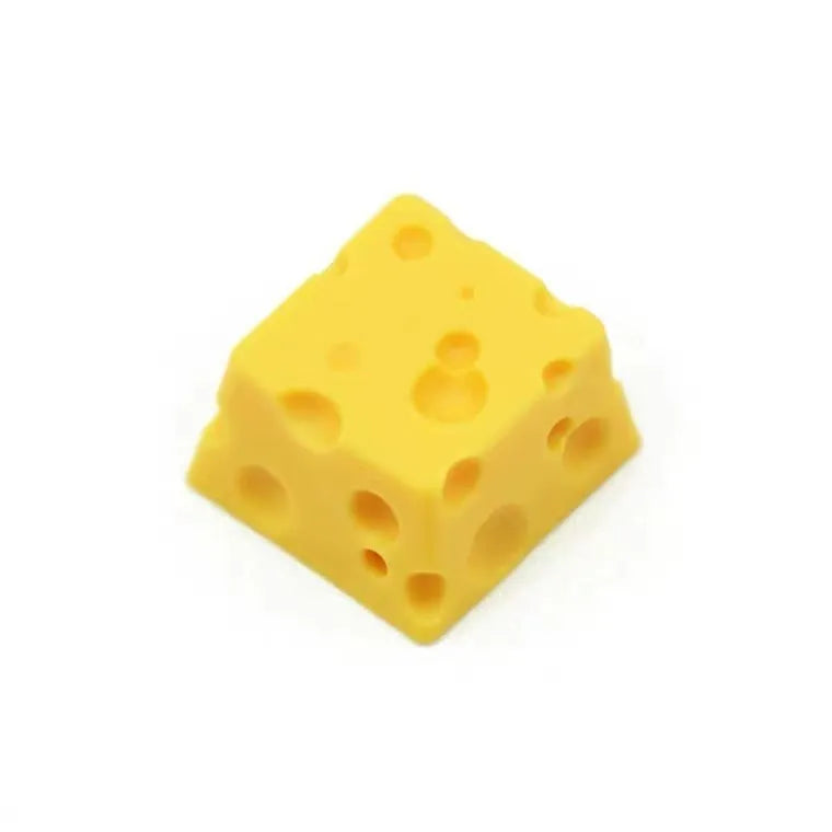 Yellow resin mechanical keyboard keycap with a detailed cheese design for MX-style switches.