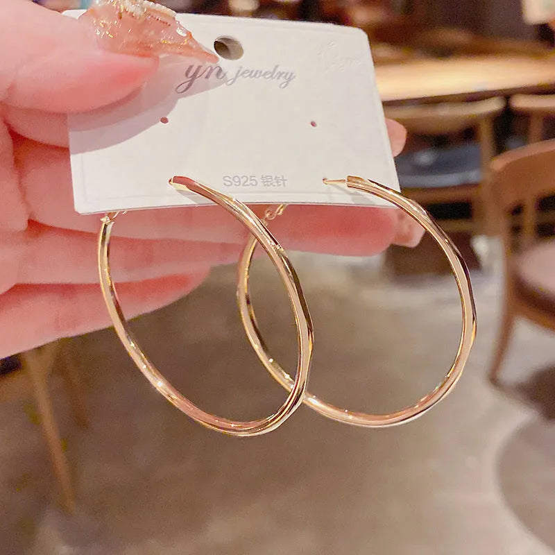 Silver needle exaggerated big hoop earrings in golden big circle with real gold plating on copper base