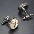 Silver geometric men's cufflinks with copper body and mechanical watch movement on dress shirt cuff