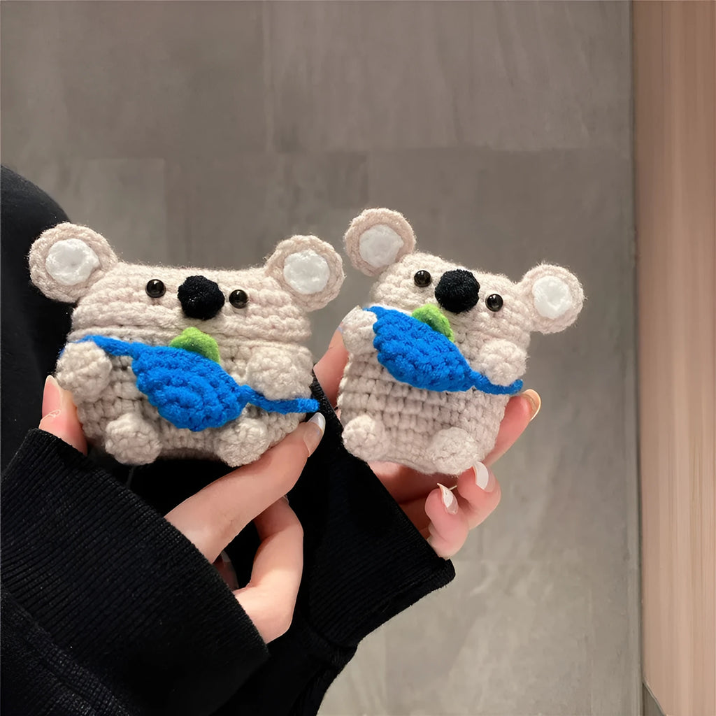 Hand knitted AirPods protective sleeve with koala bear backpack design on Apple AirPods case