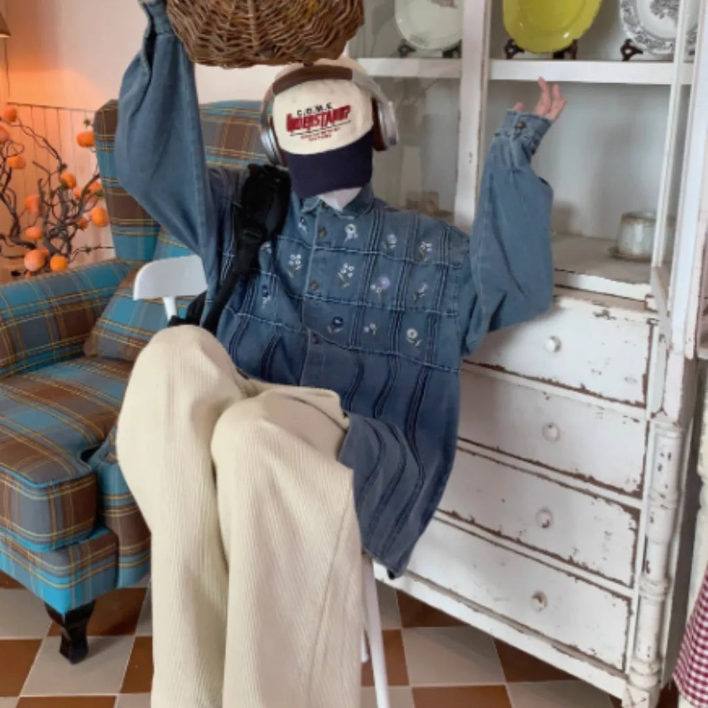 Vintage washed blue denim shirt with small floral print and pleated front on long sleeves