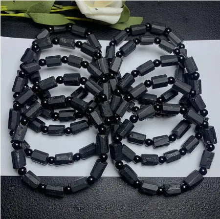 Black tourmaline rough stone bracelet with natural textured beads measuring 8.5-9mm and adjustable closure