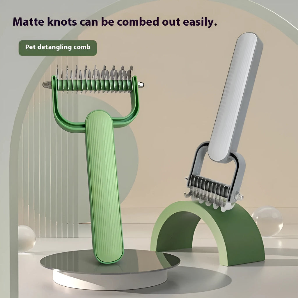 Green plastic and stainless steel dog detangling comb on a grey background.