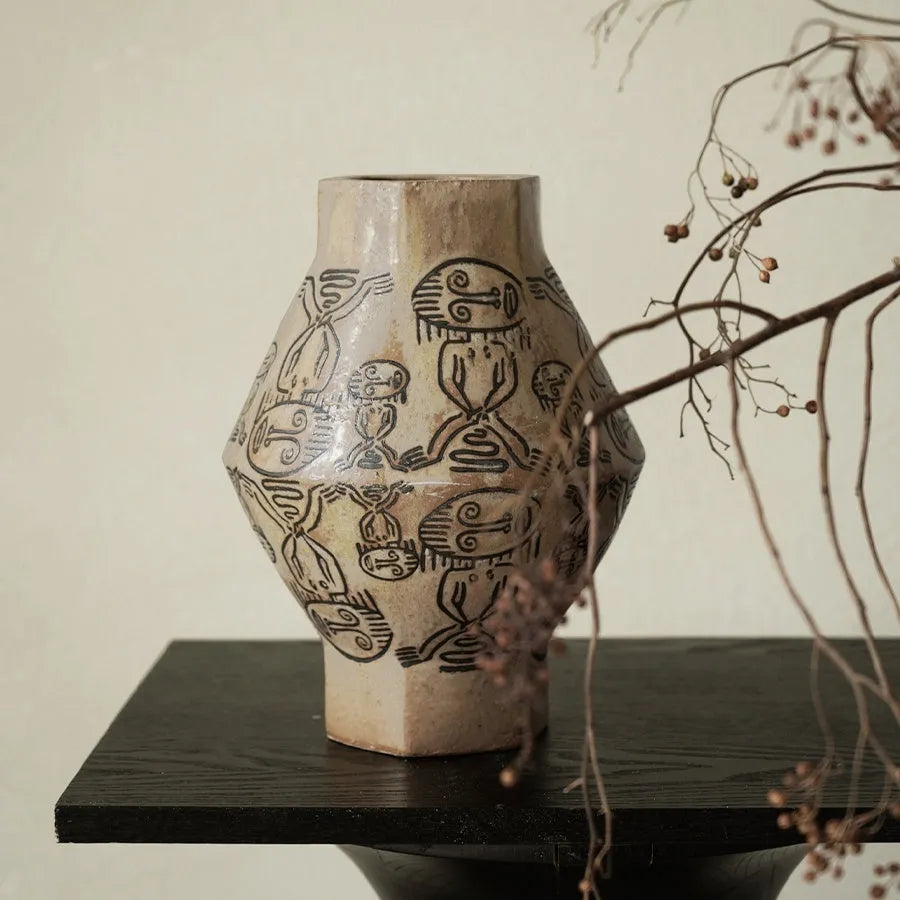 Ceramic cylindrical vase with hand-painted vintage carved tribal totem artwork