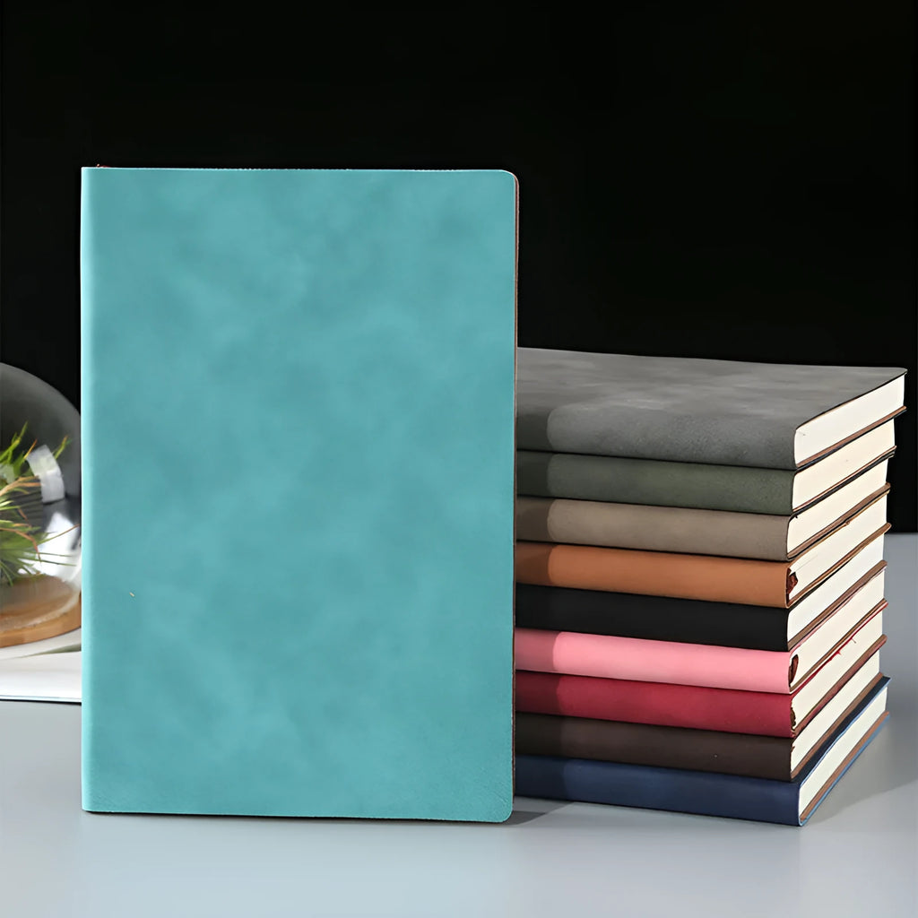 Soft noodle sheep buckle notepad in black imitation leather, open to show beige Dao Lin paper.