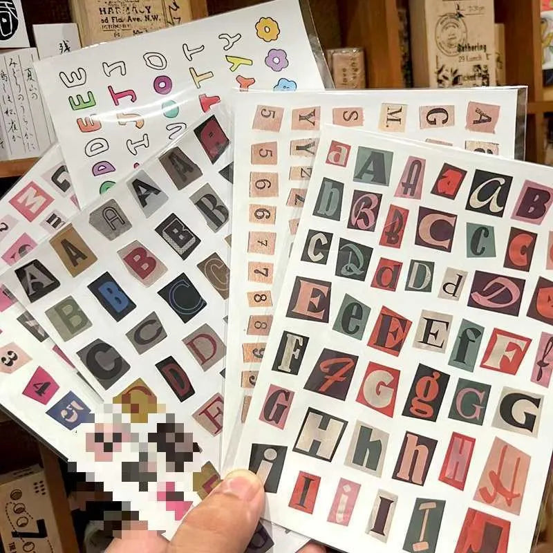 Sheet of cute style decorative stickers showing printed English alphabet letters and weekly words.