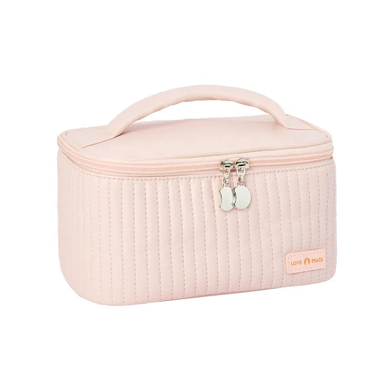 Open-top cake-shaped women's makeup bag in PU leather, shown in a soft solid colour.