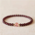 Chinese style gourd bracelet with imitation garnet stones and cultural motifs including Fu character design