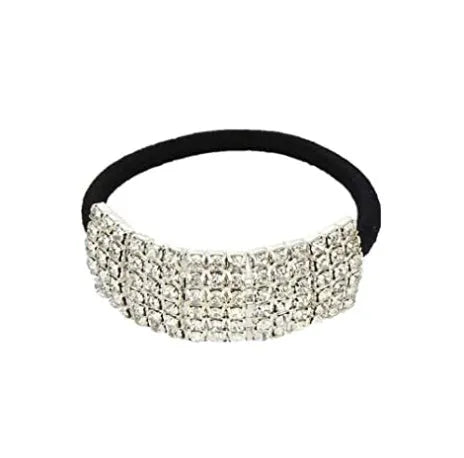 Three silver hair rings with rhinestone crystals on a light background