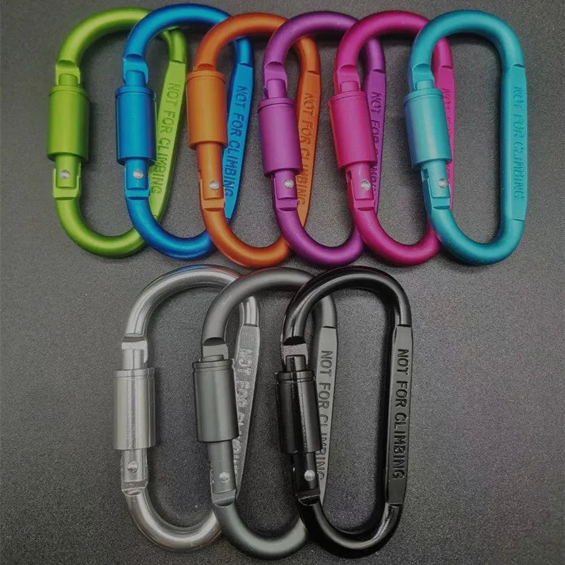 Silver D-shaped aluminium locking carabiner with an 8cm profile on a grey background.