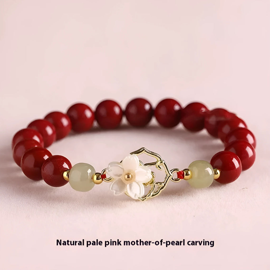 Cinnabar bracelet with Hetian Jade lotus charm and Bells of Ireland accents in New Chinese style