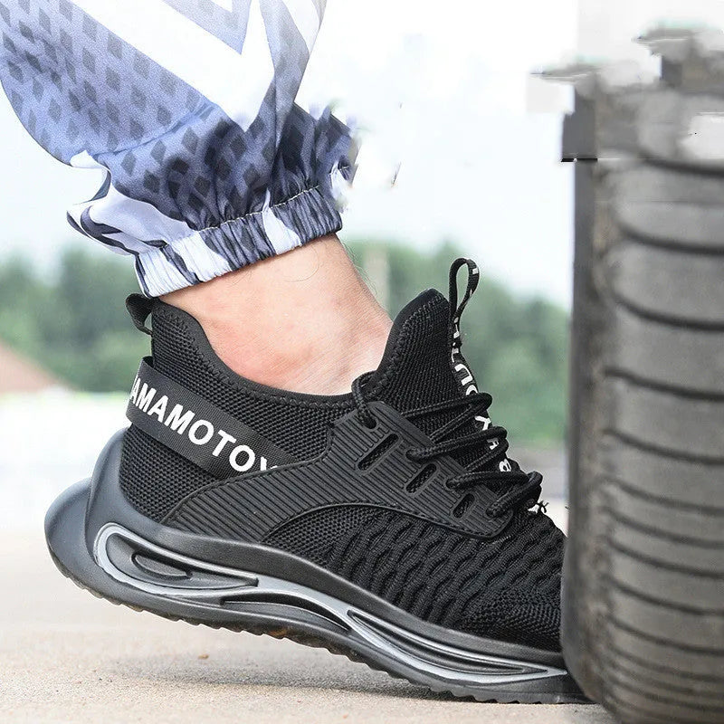 Black ultra-light steel toe anti-piercing work shoes with fly woven upper and low-top design on a white background