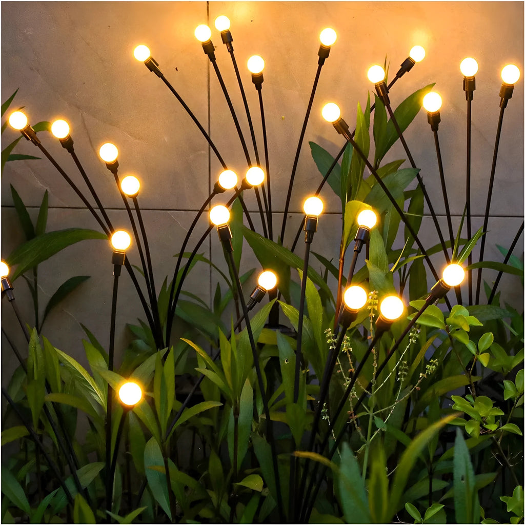 Solar-powered LED garden light with ground spike for soil installation in warm white or coloured lighting options