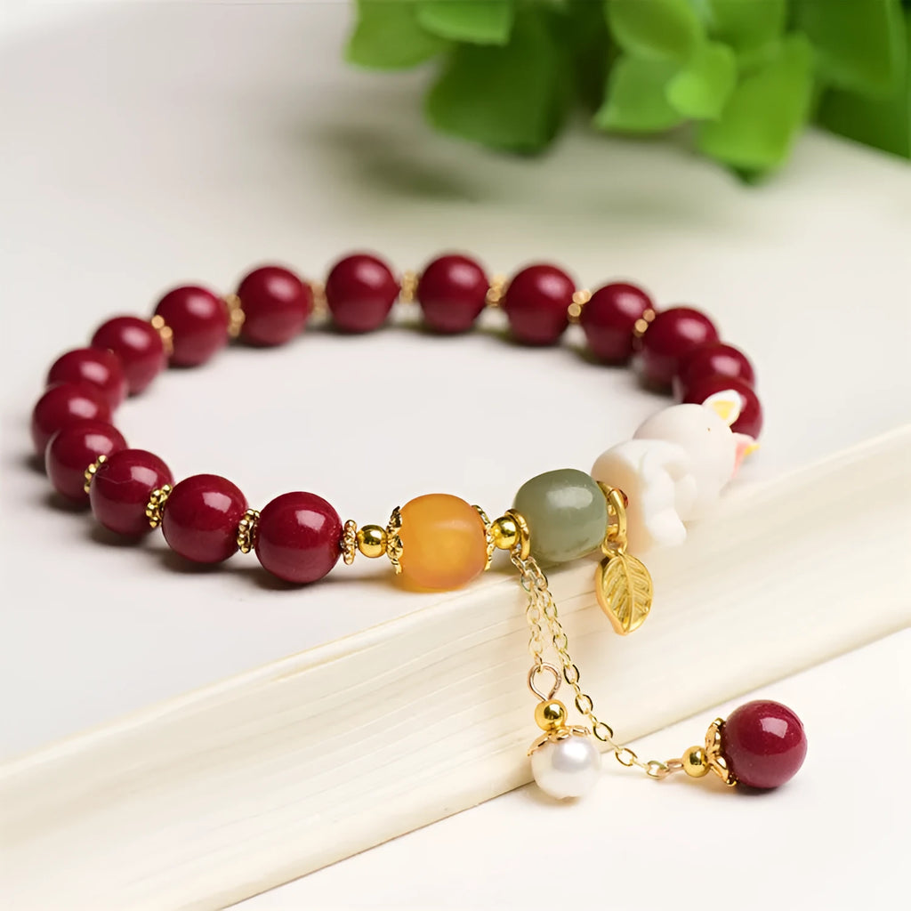 Tian Yu natural cinnabar bracelet with rabbit motif in purple gold sand colour
