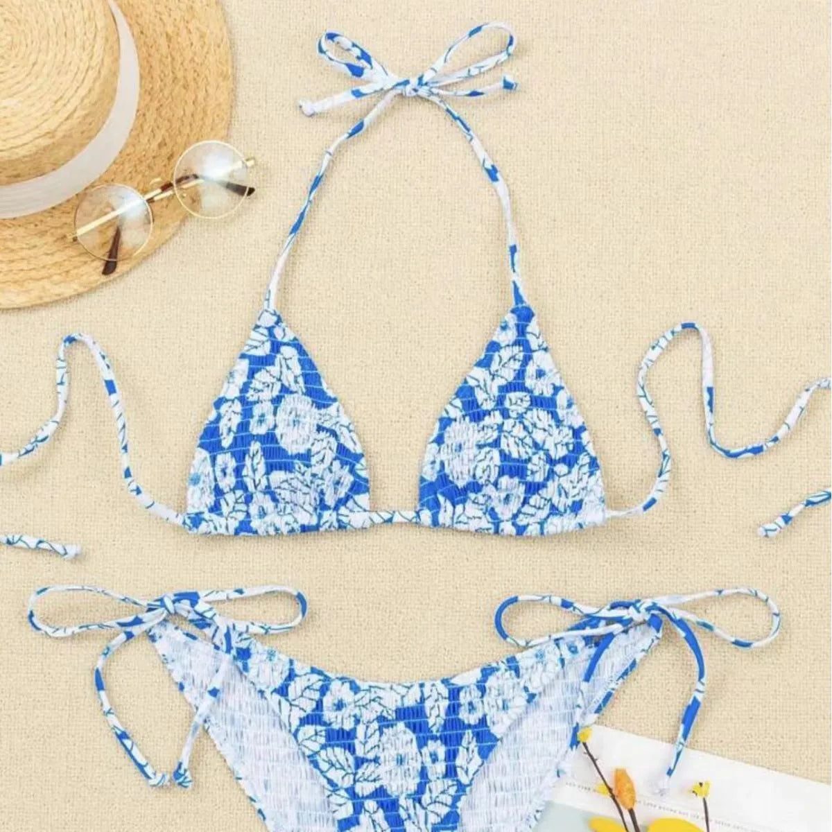 Women's floral halter swimsuit in polyester fabric showing pink colour option with brief-style bottoms