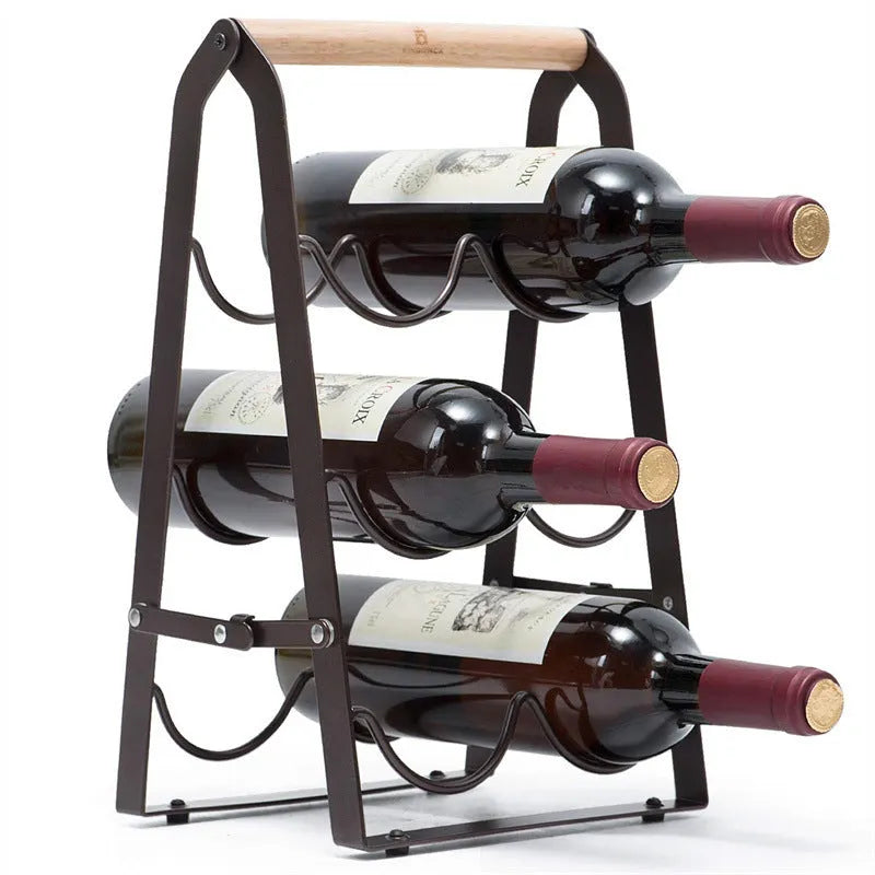 Black iron metallic desktop wine rack holding one wine bottle on a kitchen countertop