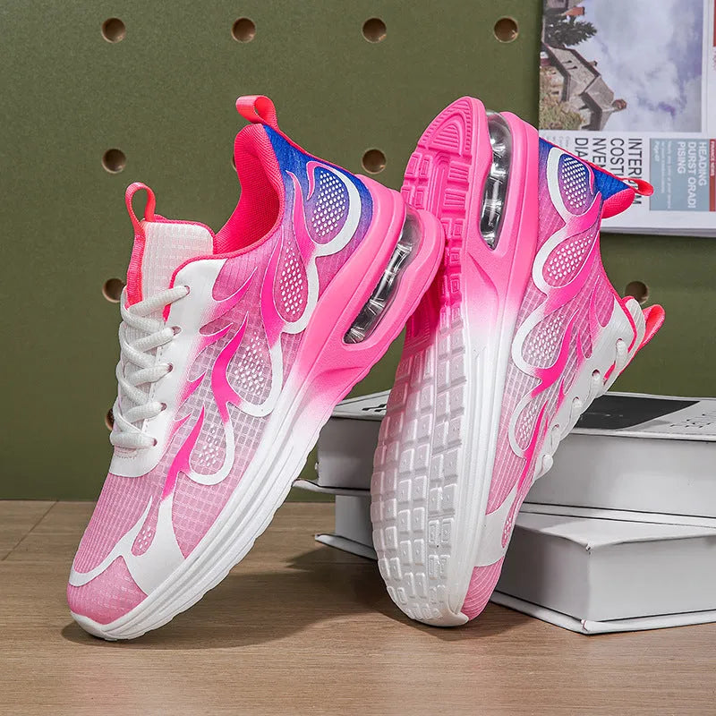 Women's pink mesh and PU sole casual sneaker shown from the side.
