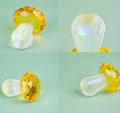 Colourful transparent crystal mushroom decoration on a white background.