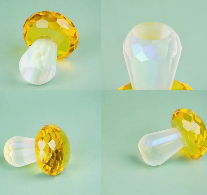 Colourful transparent crystal mushroom decoration on a white background.