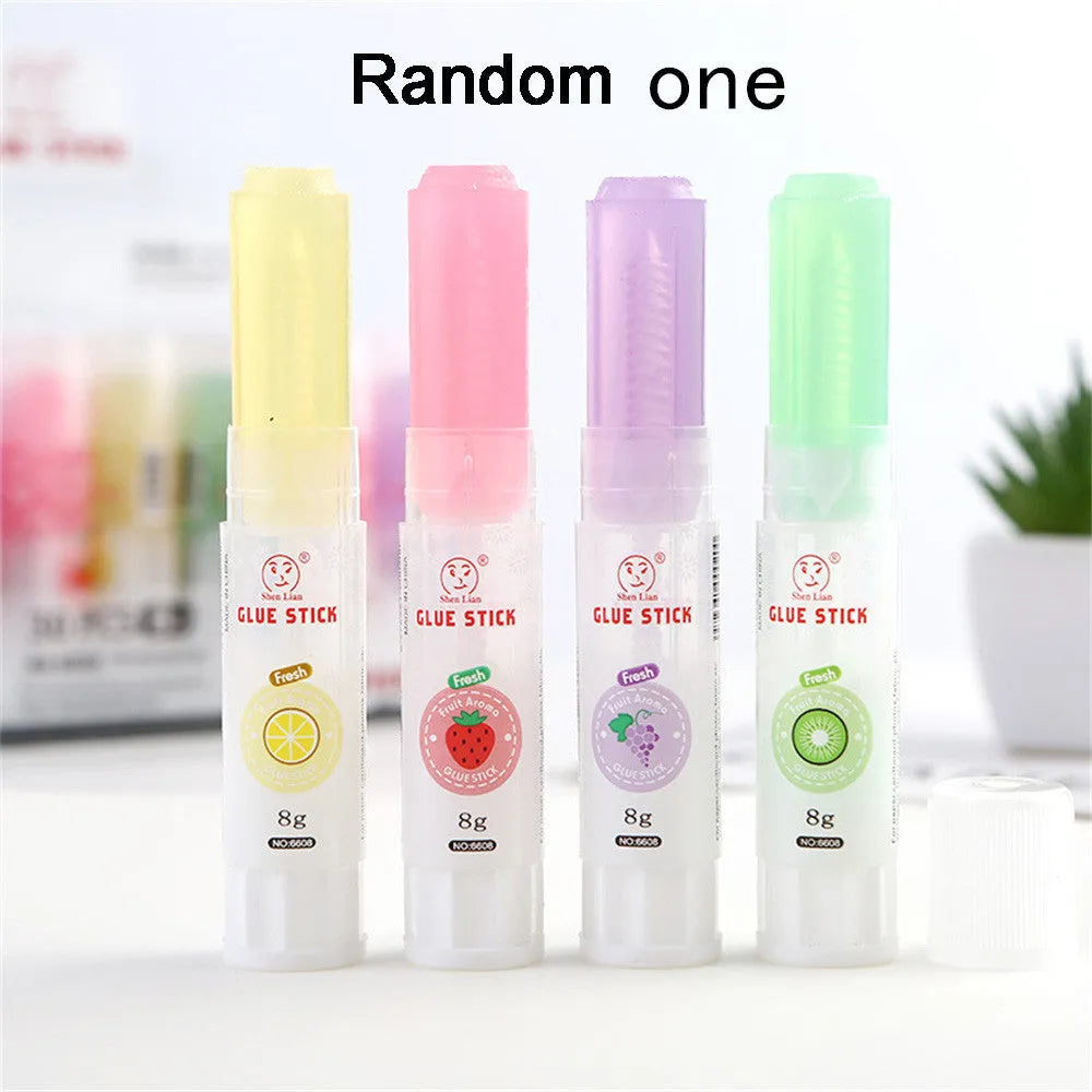 Two fruit-printed jelly solid glue sticks showing random colours and compact 8.5 cm size