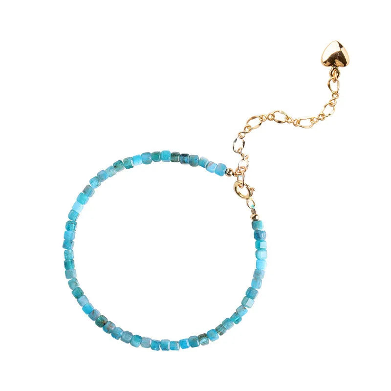 Women's natural blue apatite crystal bracelet with diamond-cut facets on adjustable band