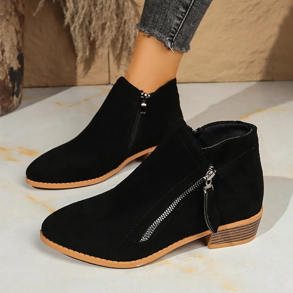 Suede women's ankle boots with side zipper in beige, shown on a white background