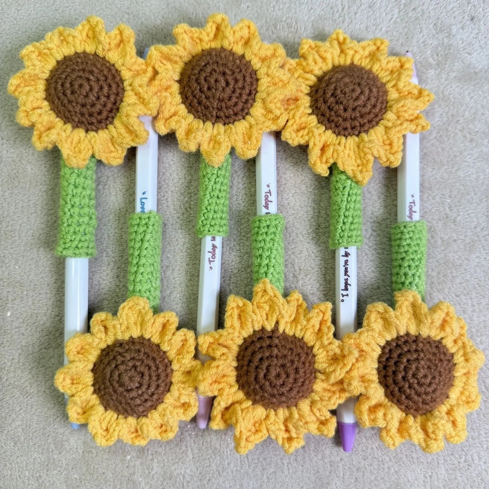 Hand-woven sunflower design pen cover in natural fabric for teacher gifts