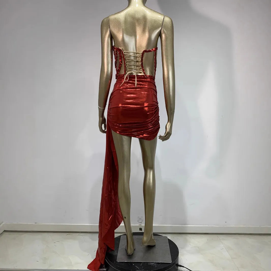 Red female skirt suit with hollow mesh see-through panels, a stage and party costume made from spandex.