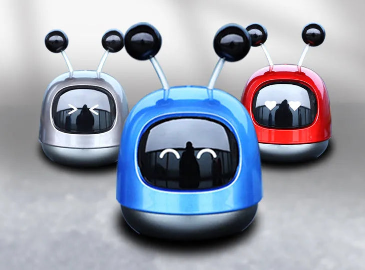 Robot-shaped car vent aromatherapy air freshener diffuser in blue, grey, or red.