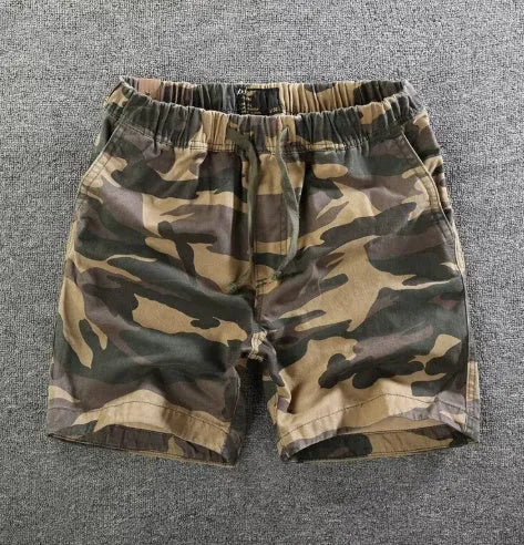 Men's cotton loose shorts in straight-leg cut with zipper fly, shown in multiple colour options including camouflage patterns
