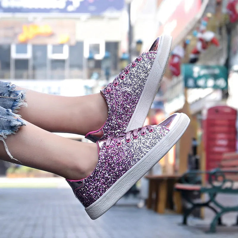 Women's black low-top lace-up shoes with glittering sequins on the upper.