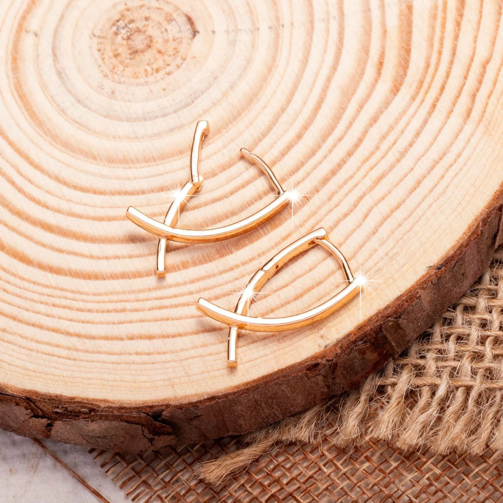 Rose gold copper cross shaped earrings with light luxury aesthetic