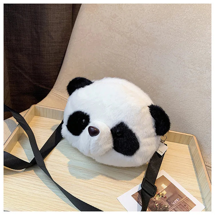 Soft plush cylindrical panda head crossbody bag with sandwich pocket.