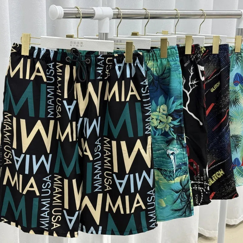 Men's loose ice silk beach pants with striped pattern showing elastic waist and quick-dry fabric