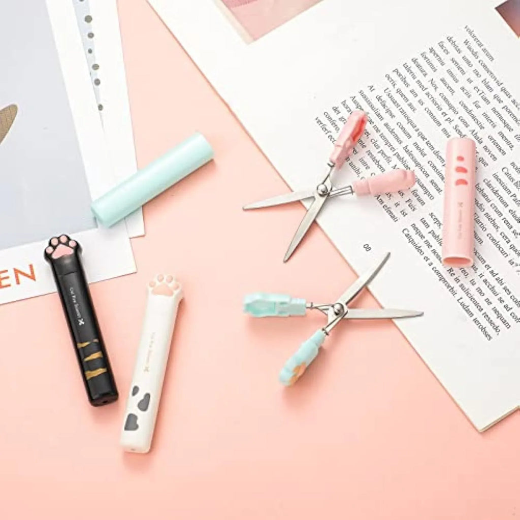 Cat paw design mini folding scissors in four colours showing stainless steel blades