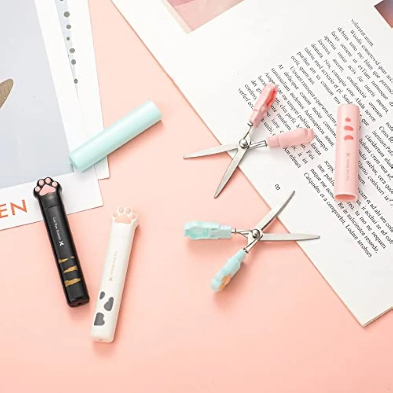 Cat paw design mini folding scissors in four colours showing stainless steel blades