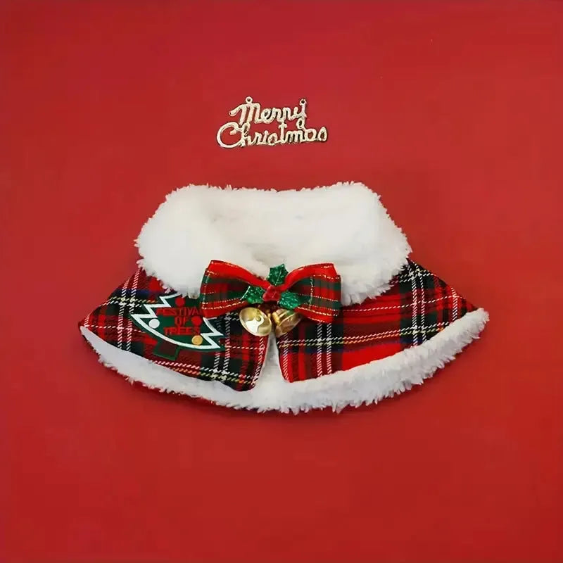 A red festive pet scarf with a bell pattern fastened around a dog's neck with an elastic collar.