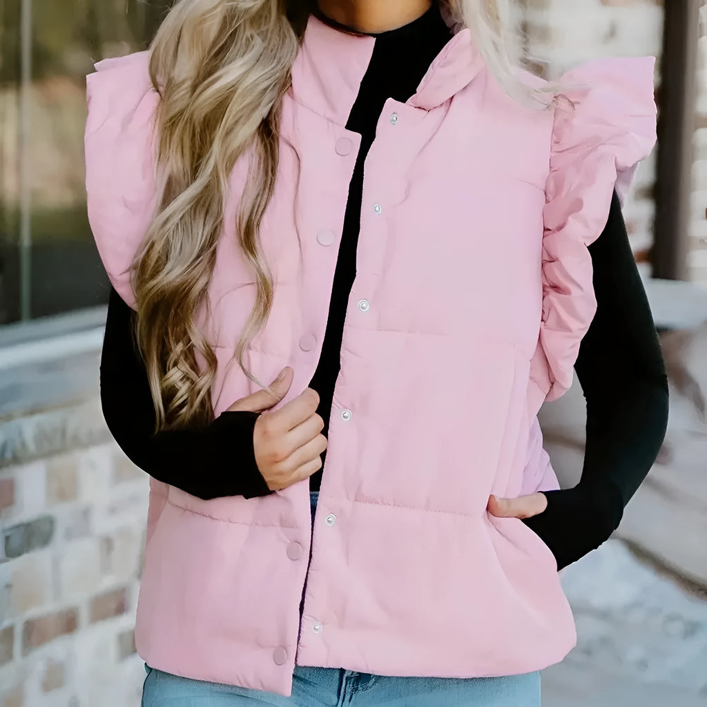Pink stand neck puffer vest with flutter sleeves and snap buttons on a plain background