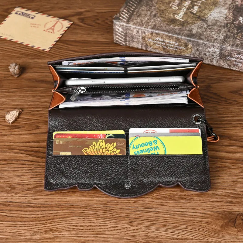 Vintage brown floral embossed women's tri-fold leather wallet showing interior organisation